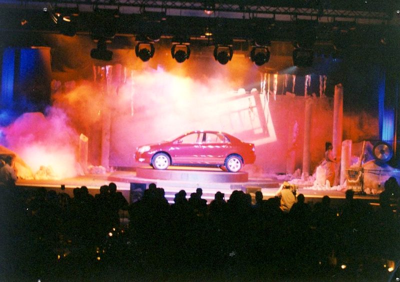 Car reveal on stage with smoke and moving lights
